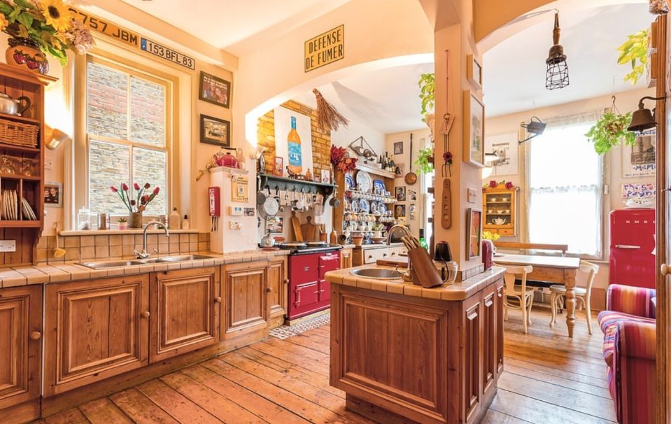  The bright kitchen gives the home a cottage feel with an Aga oven