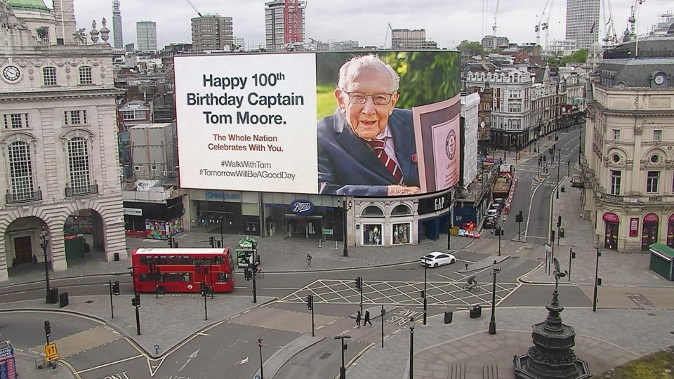 A tribute to  Captain Tom displayed  in London’s Piccadilly Circus on his 100th birthday