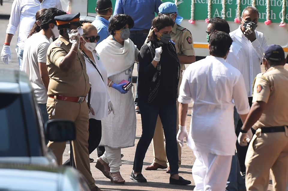  Actress Neetu Sing, centre left, arrives at the crematorium for her husband's funeral