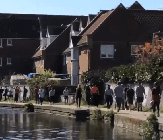  Dozens of people were seen walking along the canal in Hackney on Sunday morning