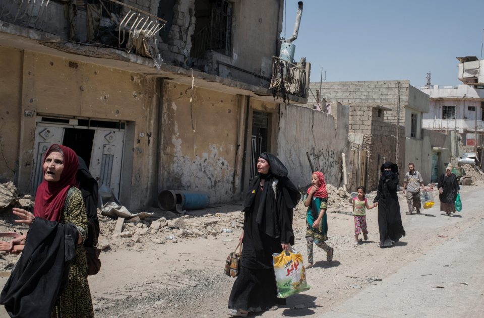  Iraqi civilians in the Old City of west Mosul, Iraq - a former stronghold of ISIS