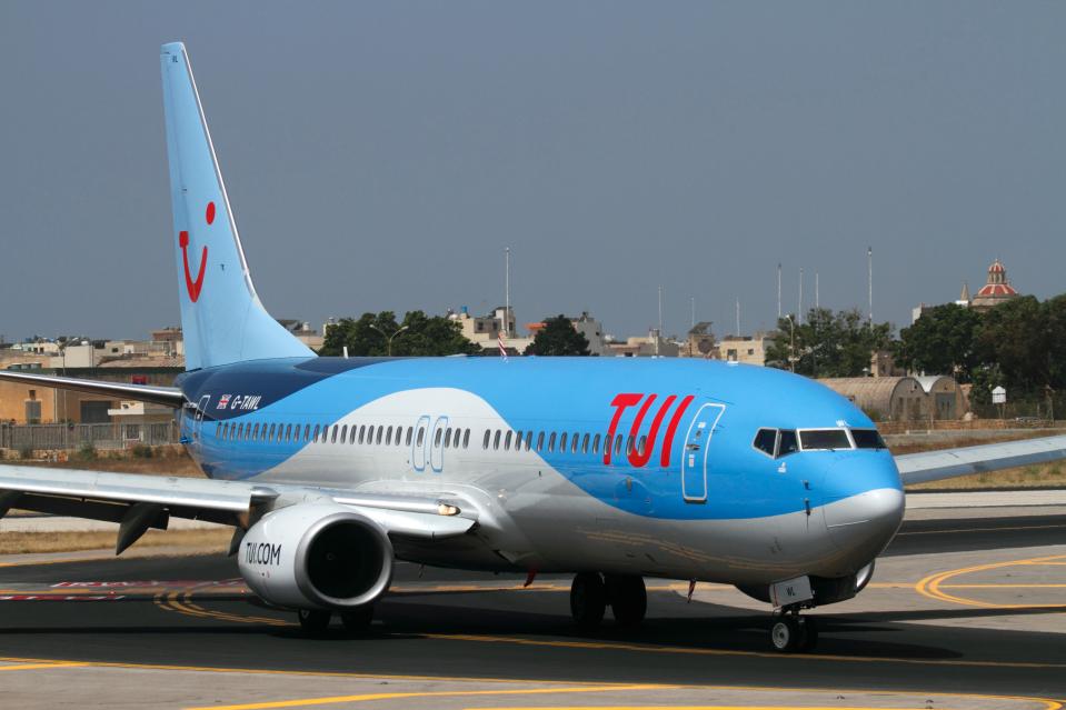 TUI Airways Boeing 737-800 passenger jet plane taxiing on arrival in Malta