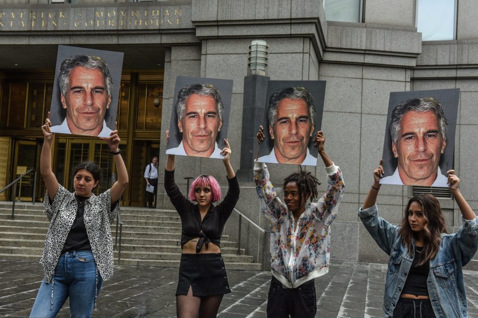  A protest group called "Hot Mess" hold up signs of Jeffrey Epstein in front of the Federal courthouse back in July 8, 2019.