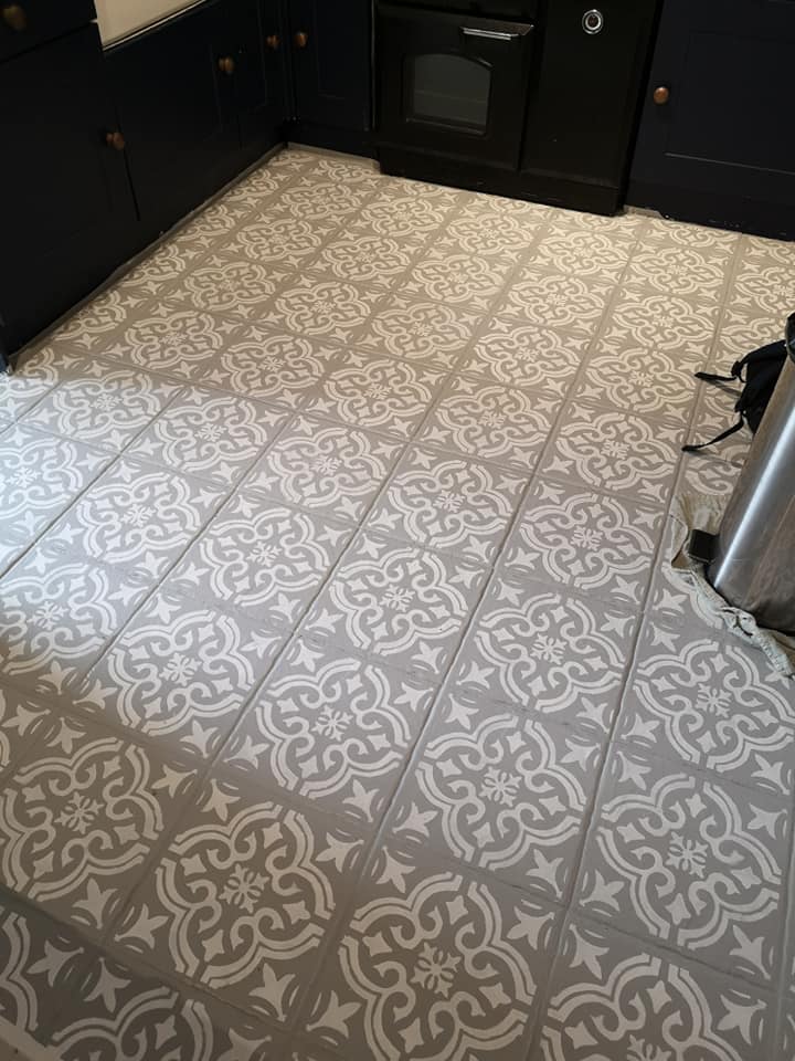 A clever DIY fan used a paint test pot and a stencil to spruce up her outdadted tiles