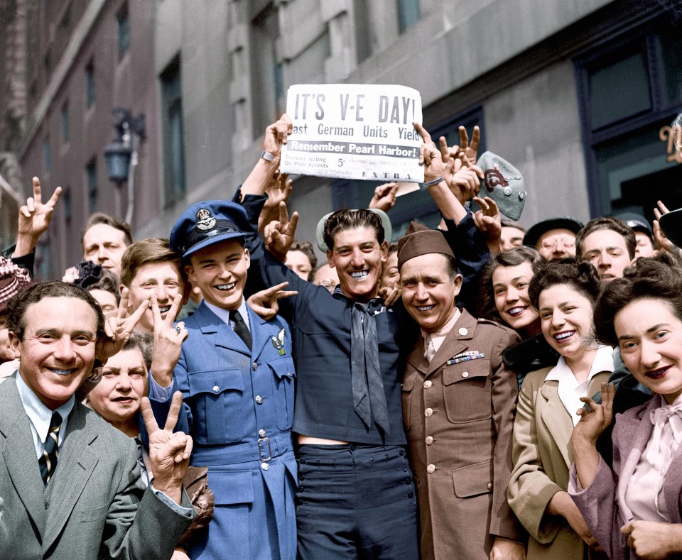 Servicemen and women celebrate the end of the hostilities in Europe