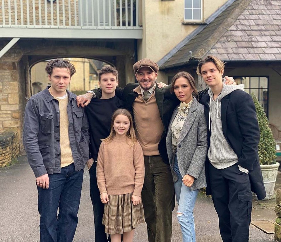 David Beckham poses alongside wife Victoria and their four children outside their Cotswolds home