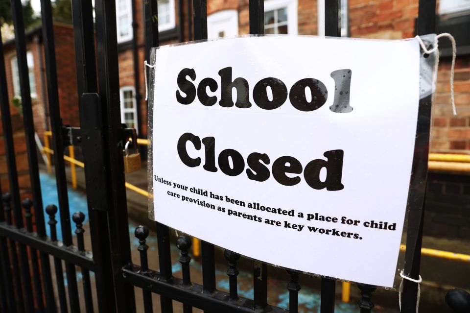  A sign on the gates of a closed school on March 30