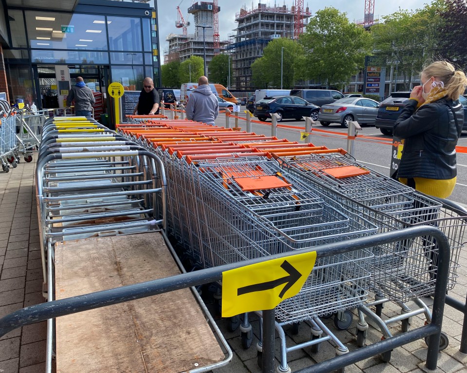  Shoppers must queue outside before entering the store in Brighton