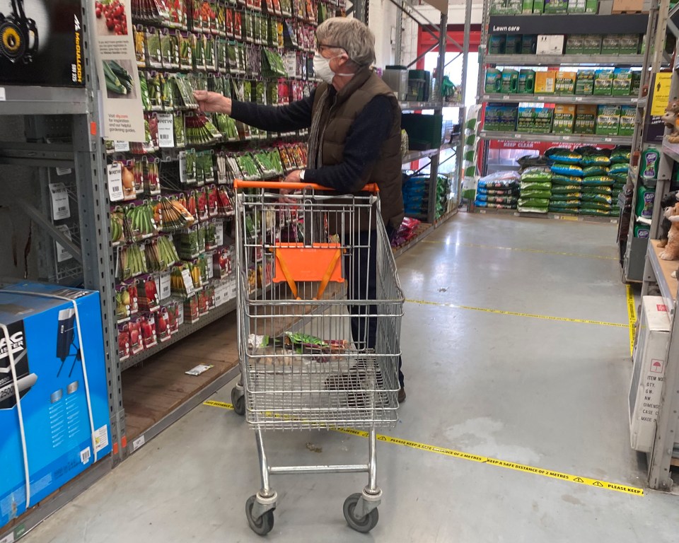  DIY shopper wearing a mask in an aisle in Worthing's B&Q