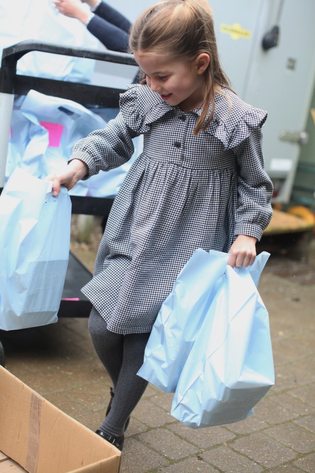  Charlotte happily sorts out the various deliveries of home-made grub