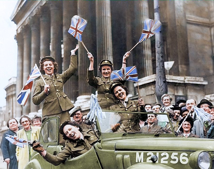  Members of the Auxiliary Territorial Service driving through Trafalgar Square in a service vehicle during the VE Day celebrations in 1945