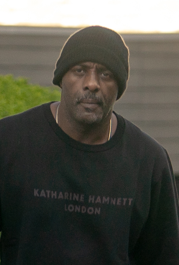 The actor, 47, had plenty of swagger as he went for a walk in blue jeans, a Katharine Hamnett T-shirt and a beanie hat