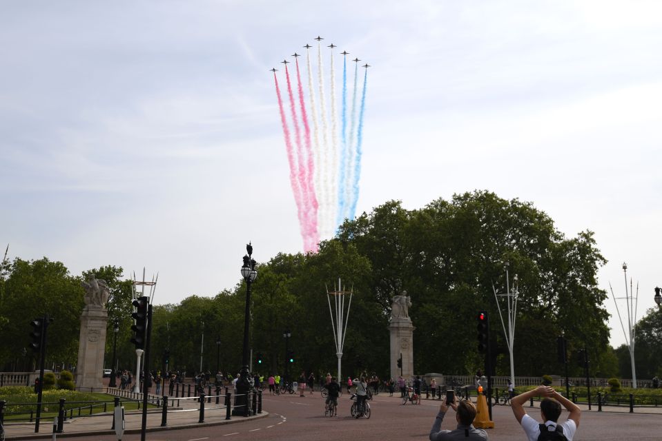  The flypast soared over Buckingham Palace as Brits watch from below