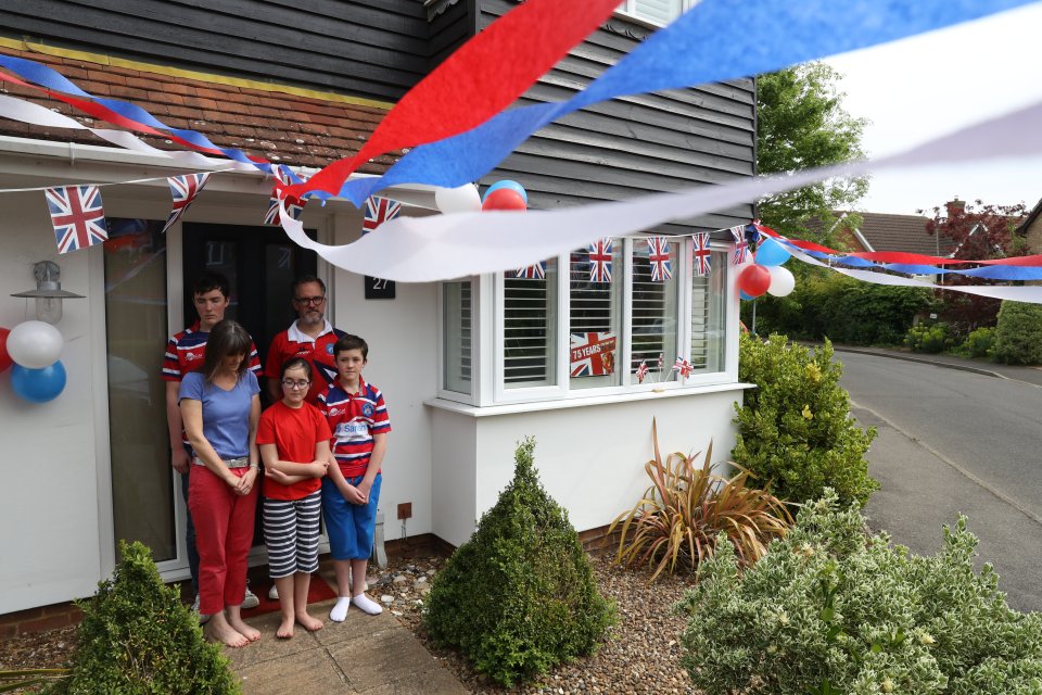  A family in Tonbridge, Kent, pay their respects to those who served in the War from their front door