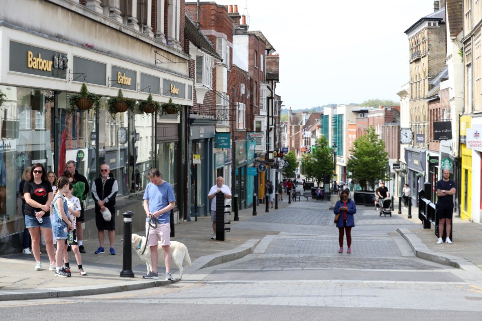  Brits are seen holding a two-minute silence in Windsor