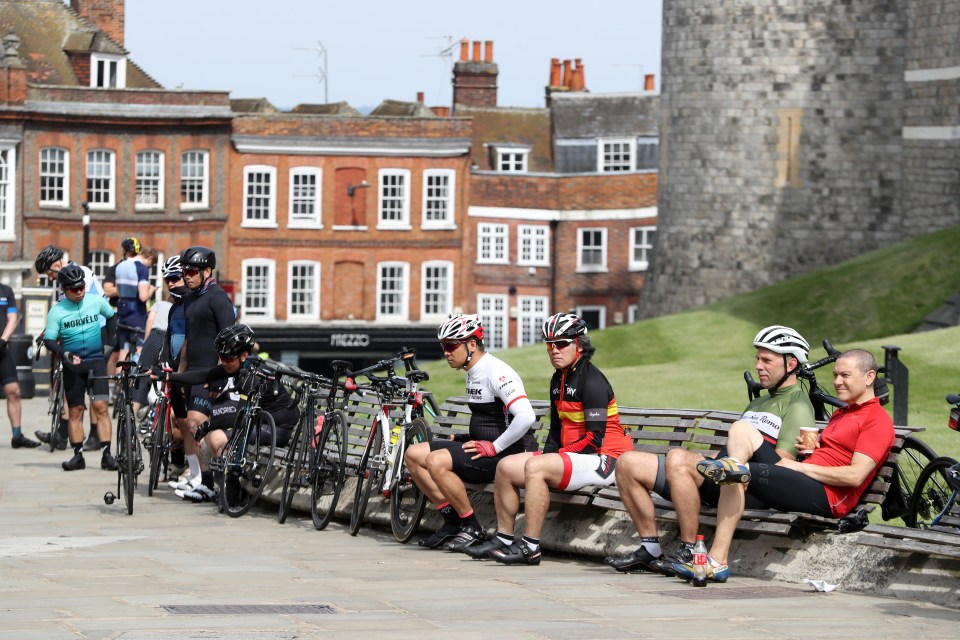  A group of cyclists stop for a breather in Windsor, Berks, today