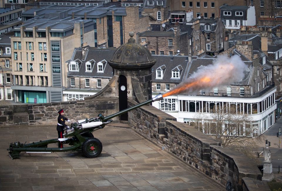  Sergeant David Beveridge fires a Gun Salute from the ramparts of Edinburgh Castle, to mark the start of the two-minute silence