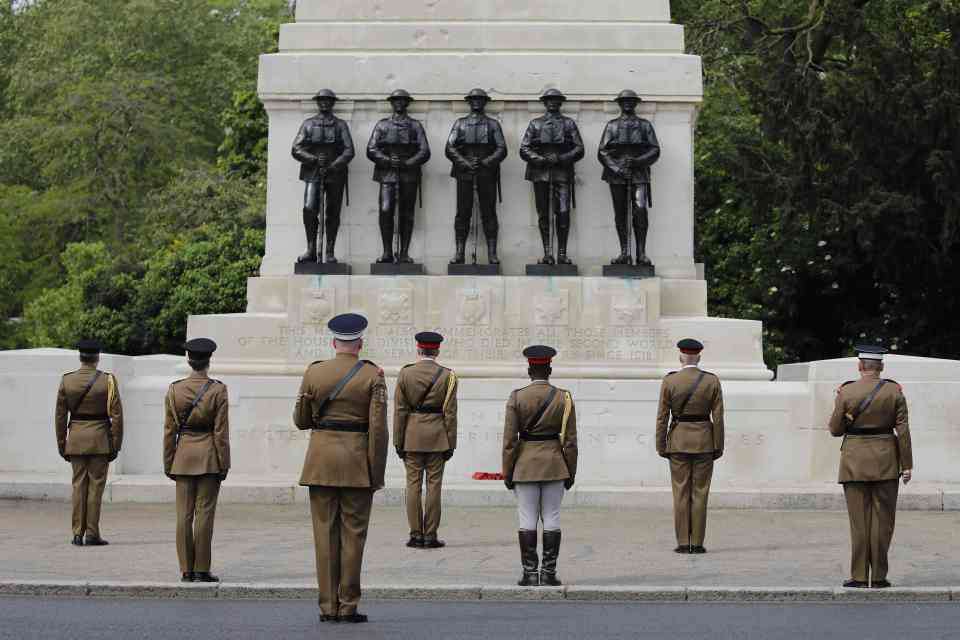  Officers and soldiers of Household Division observe social distancing as they stand silent at Horse Guards Parade in St James's Park today