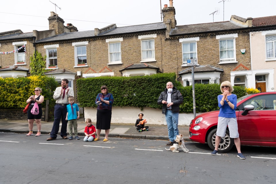  Defiant Brits clapped in the street to mark the end of the silence