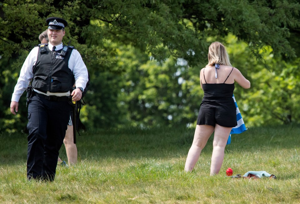  Members of the public move after being spoken to by cops on Primrose Hill today