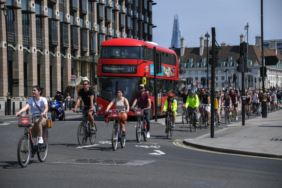  Hundreds of cyclists made their way through a hot central London on Friday afternoon