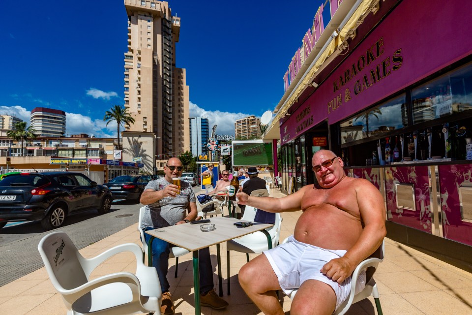  A pair of drinkers enjoy a beer at a Benidorm bar today