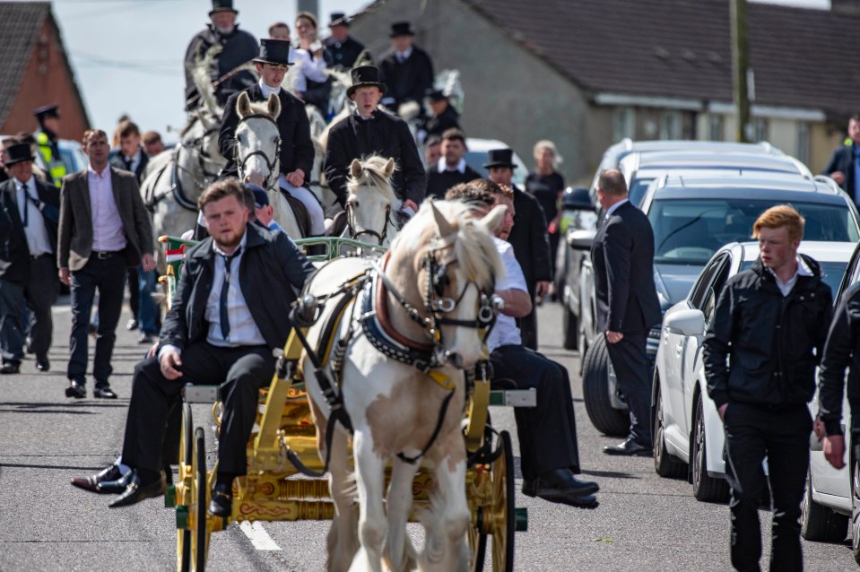  The cortege included two horse-drawn carriages and scores of vehicles