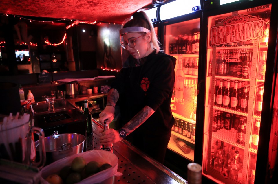  Bar staff wear PPE as pubs also reopened in Germany this week