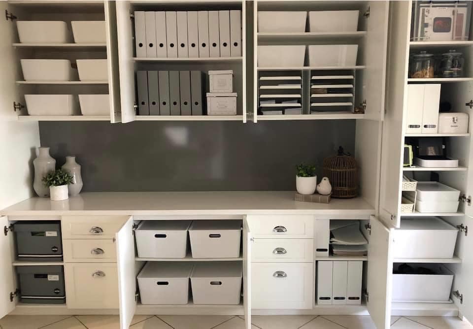 Each cupboard has been organised with boxes and dividers so she can easily store items