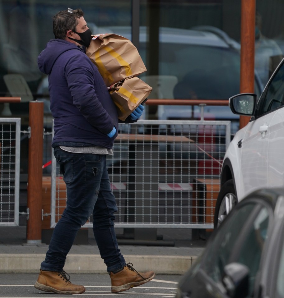  Eager customers carried bags of takeaway to their cars this morning