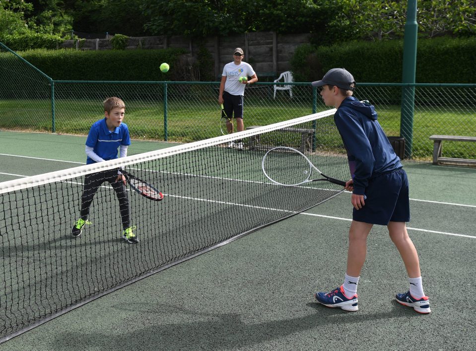  Youngsters play tennis after the UK eased lockdown restrictions