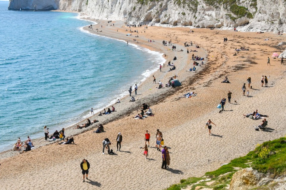  Visitors flock to Durdle Door in Dorset on a day of hot sunshine on the first weekend after the coronavirus lockdown restrictions were eased