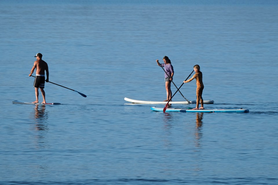  A family got up early to enjoy the sun and water at Branksome beach in Dorset