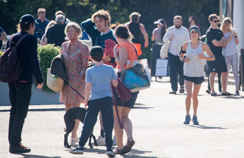  Members of the public are seen enjoying the warm weather in the early morning at Hyde Park in London during lockdown