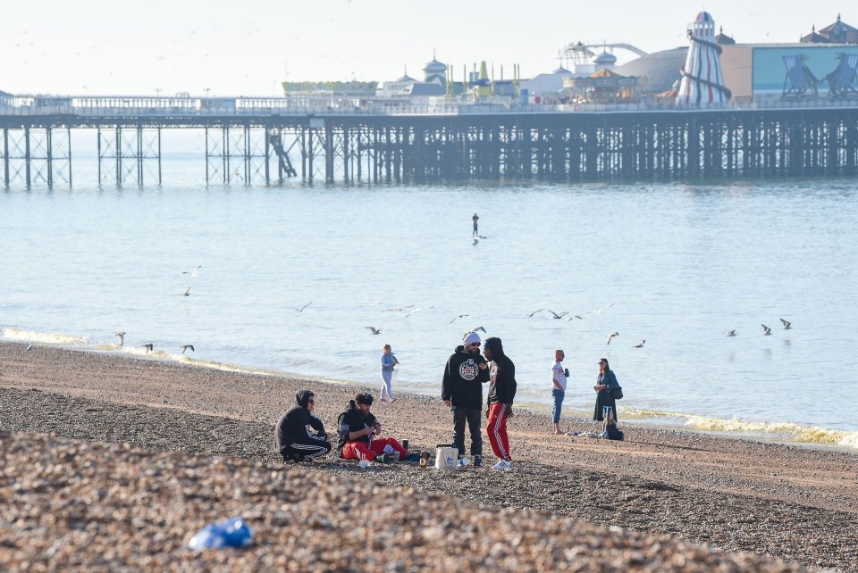  Visitors gather on Brighton beach this morning in hot sunny weather as temperatures are forecast to reach the high 20s in some parts of Britain