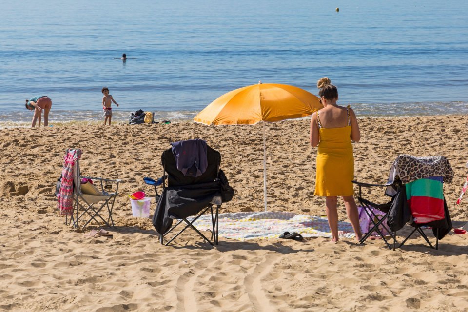  Sunseekers head to Bournemouth beach early to enjoy the sunshine and get the best spot on what is forecast to be the hottest day of the year so far