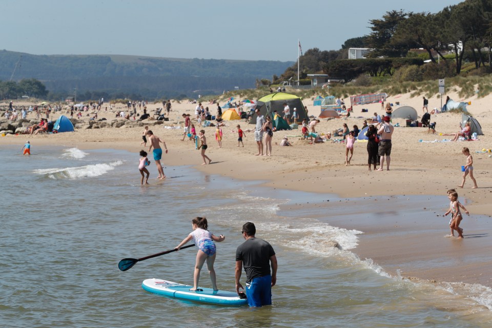  Thousands of people flocked to Sandbanks in Poole, Dorset, on the hottest day of the year so far