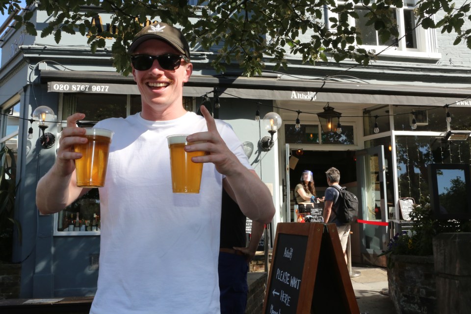  The sun and the booze put smiles back on faces as boozers enjoyed beers in plastic pints