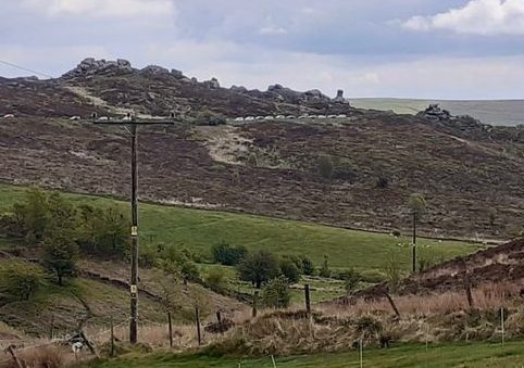  Cars can be seen snaking around the hills of the Peak District