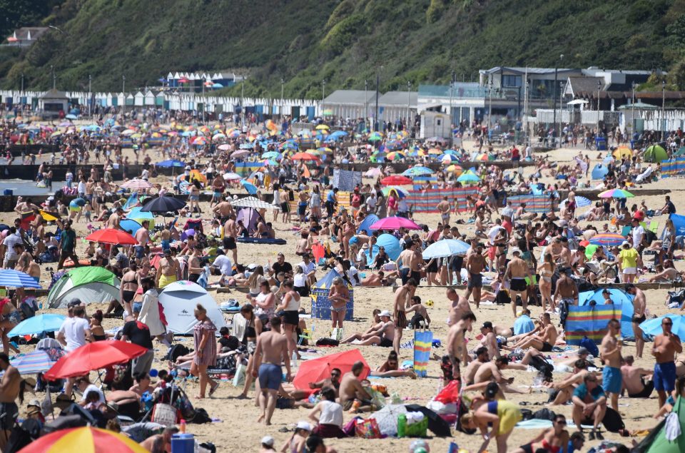  Brits enjoy the hot weather at Bournemouth beach on Bank Holiday Monday