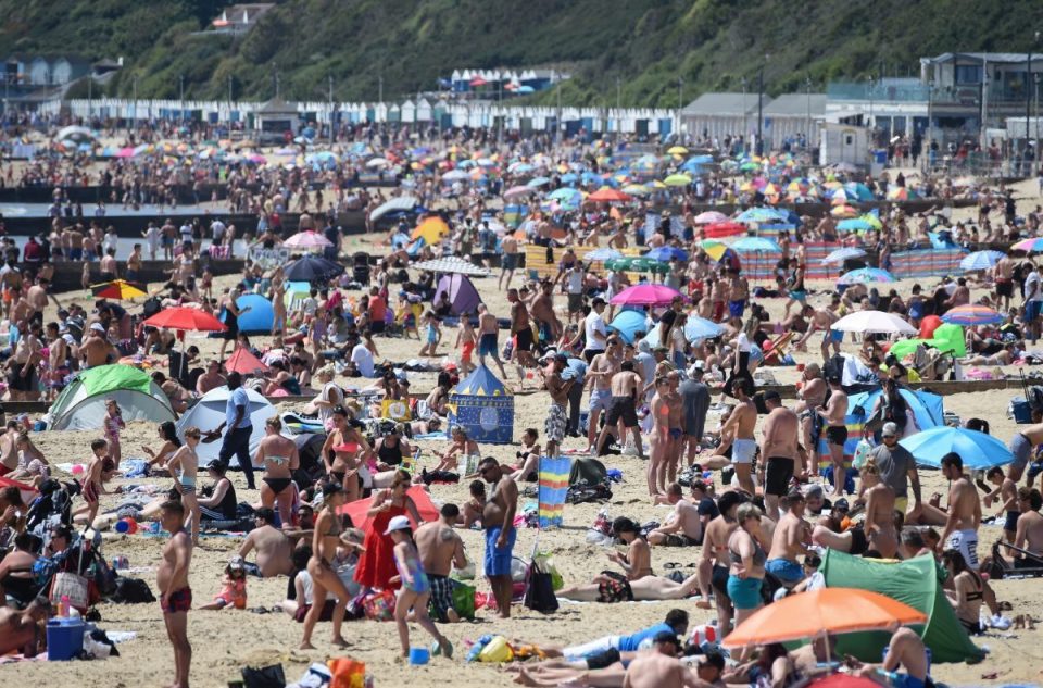  People enjoy the hot weather at Bournemouth during the UK's spring bank holiday on May 25, in Bournemouth