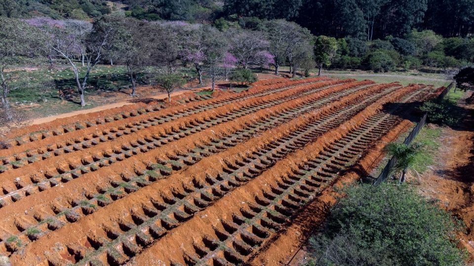  Haunting photos from Sao Paulo's Cemitério de Vila Formosa, the largest cemetery in Latin America, show rows of new graves