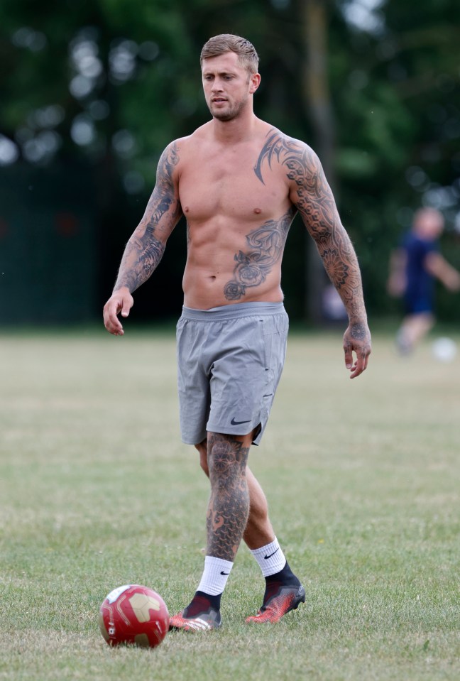  Dan Osborne stripped off for a game of football in the park on Monday