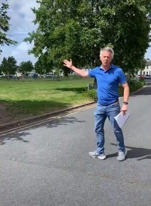  Matt Ferris, co-headteacher at Kingsholm Primary School points to where parents will be expected to queue when they drop-off their child to their allotted pen in the morning