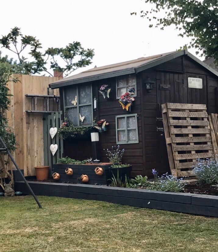 The side of the shed looked very different before the makeover