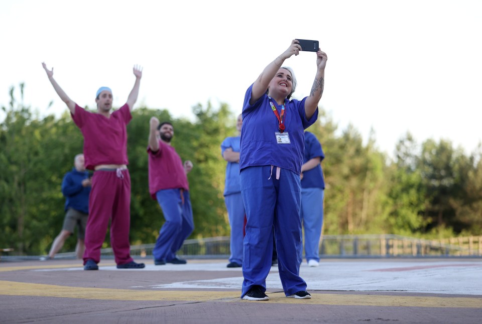 Excited key workers posed for a picture on what could be the last of the Clap for Carers