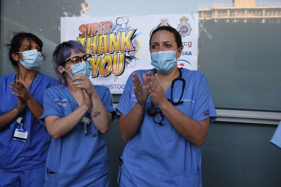 Medical staff in masks clapped as the nation thanked them for their service