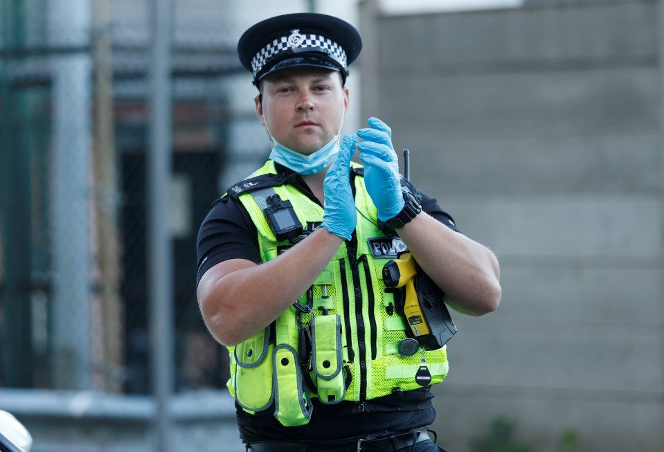 A police officer on patrol paused and clapped for key workers