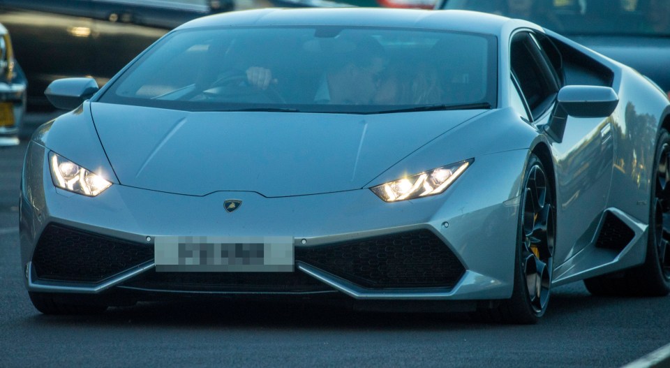  Megan and Harry couldn't resist having a snog in his Lamborghini