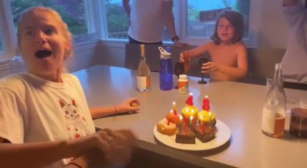  Patsy beams as her family surprise her with treats